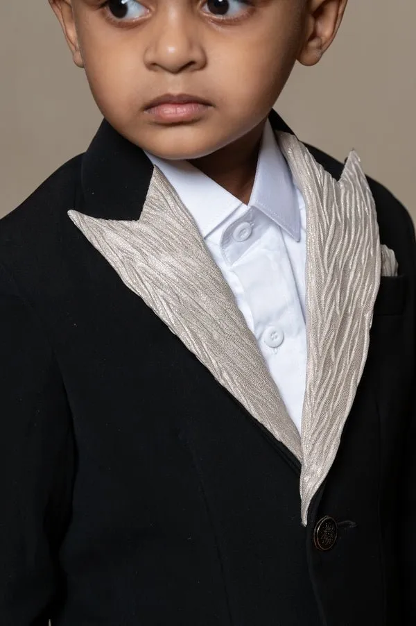 Classic black blazer with a champagne metallic-textured lapel, paired with matching pants and a crisp white shirt for a sophisticated formal look